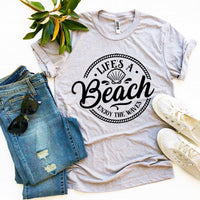 Thumbnail for Life’s a Beach Enjoy The Waves T-shirtProduct description:
Look and feel your best with this Life’s a Beach Enjoy The Waves T-shirt! It's made of premium quality ring spun cotton for a soft, comfortable T-shirtsEXPRESS WOMEN'S FASHIONAgateBeach Enjoy